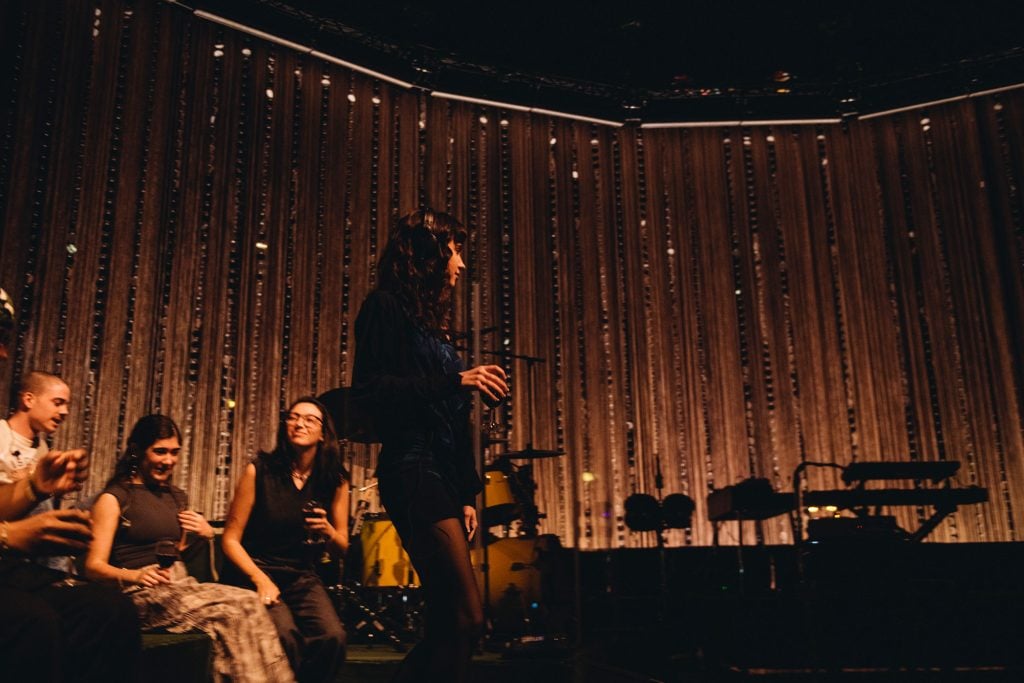Clairo's night at London’s Eventim Apollo is a masterclass in how to make a sit-down show not boring