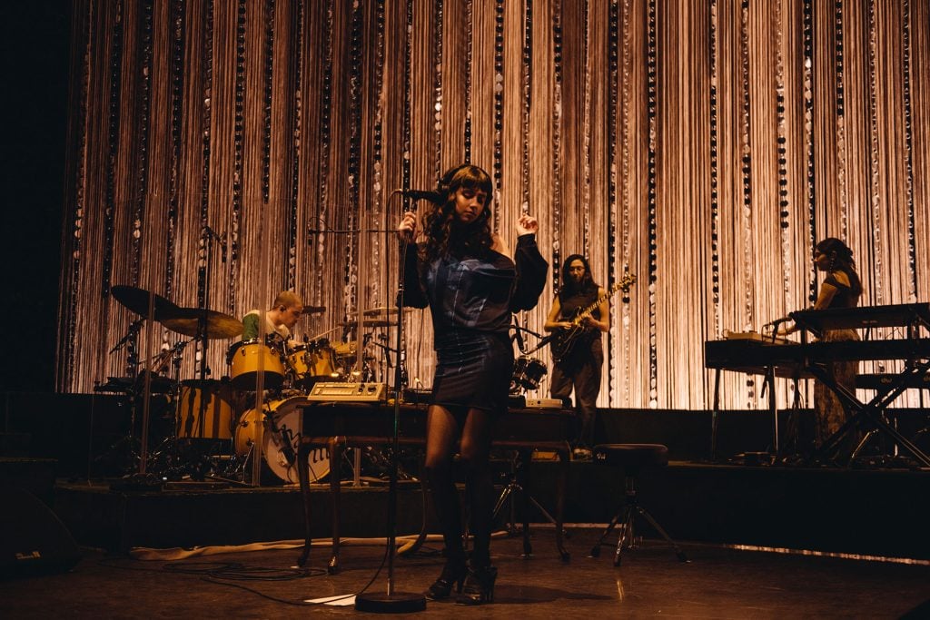 Clairo's night at London’s Eventim Apollo is a masterclass in how to make a sit-down show not boring