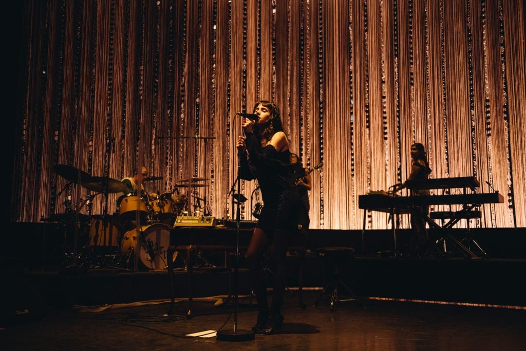 Clairo's night at London’s Eventim Apollo is a masterclass in how to make a sit-down show not boring