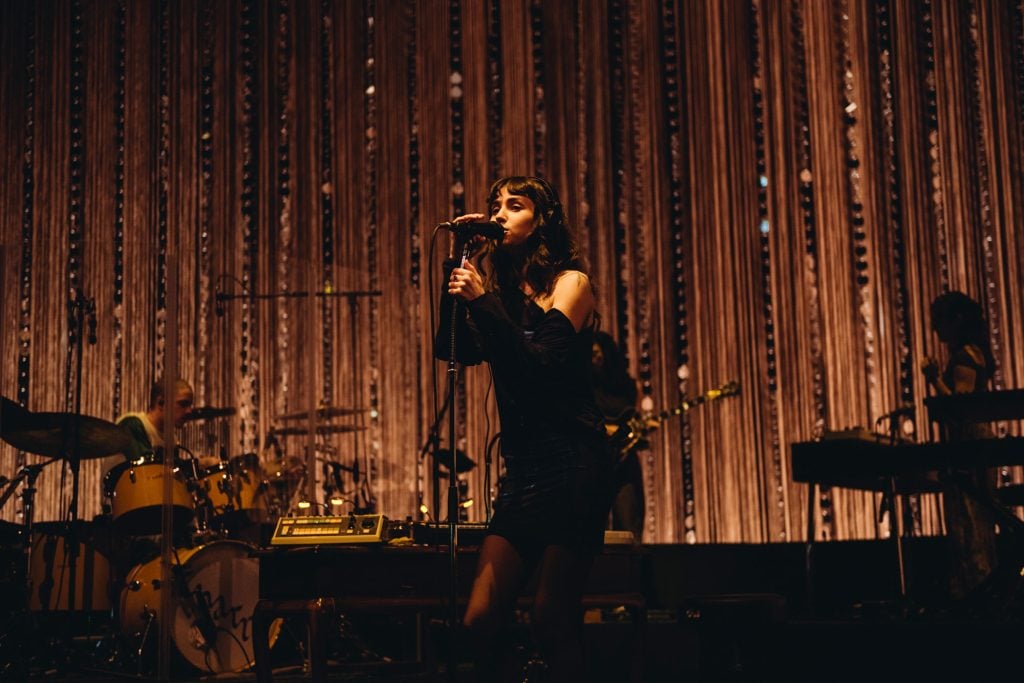 Clairo's night at London’s Eventim Apollo is a masterclass in how to make a sit-down show not boring